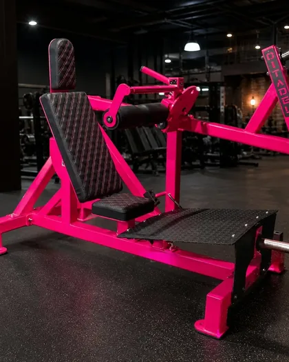 Citadel Strength Hip Thrust in Barbie Girl pink on a commercial gym floor.